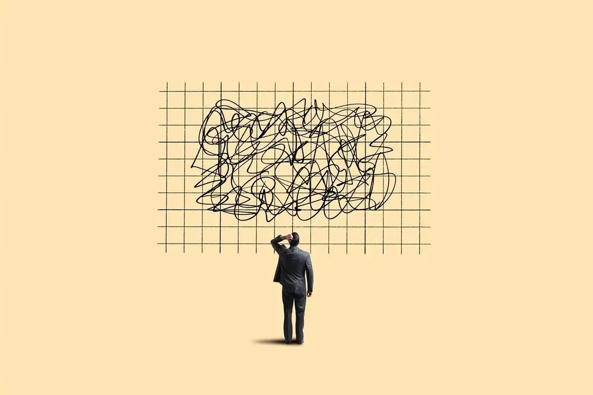 Illustration representing a tiny figure viewed from behind, standing on a light yellow background and looking up at a complex, tangled scribble set inside a neat black grid pattern