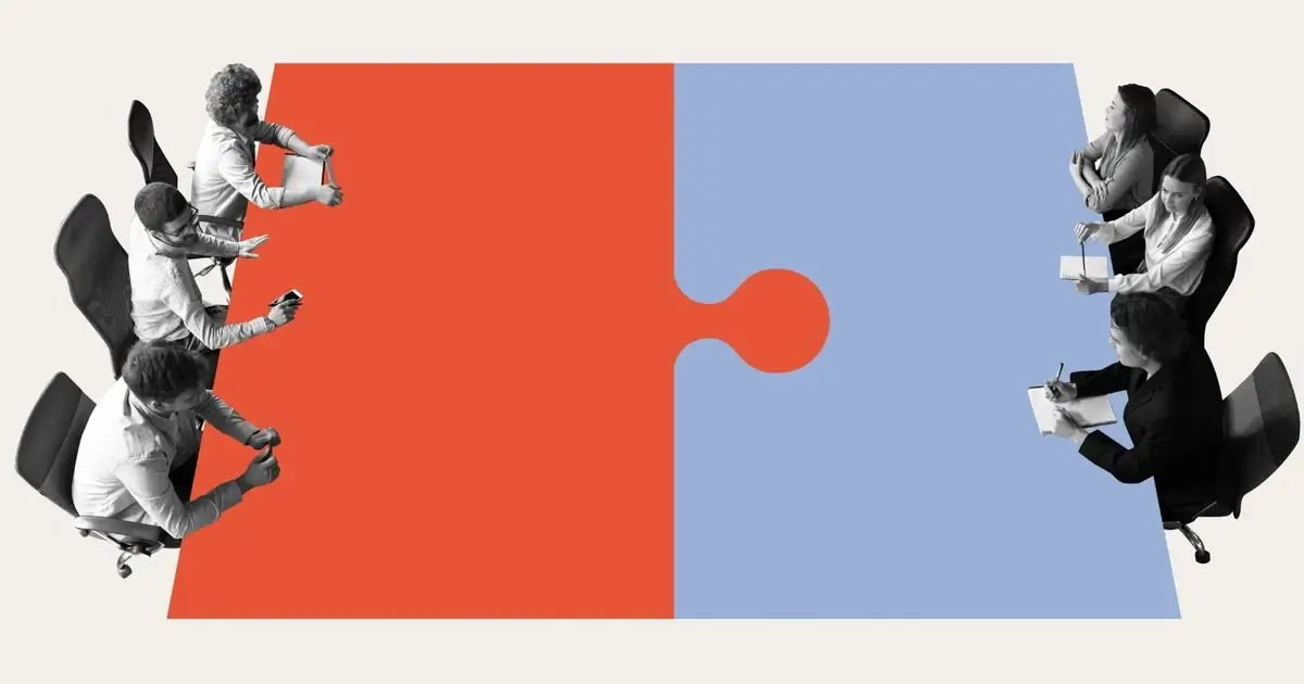 An illustration representing two groups of professionals seated around a large red and blue jigsaw puzzle table